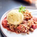 Warm rhubarb crumble with a golden crisp topping
