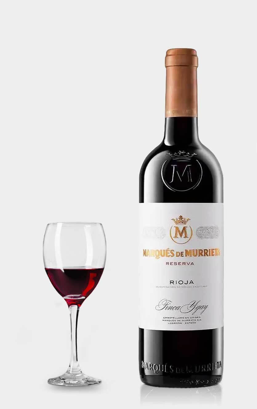 En flot flaske Marqués de Murrieta Reserva rødvin fra Rioja serveret ved siden af et glas rødvin