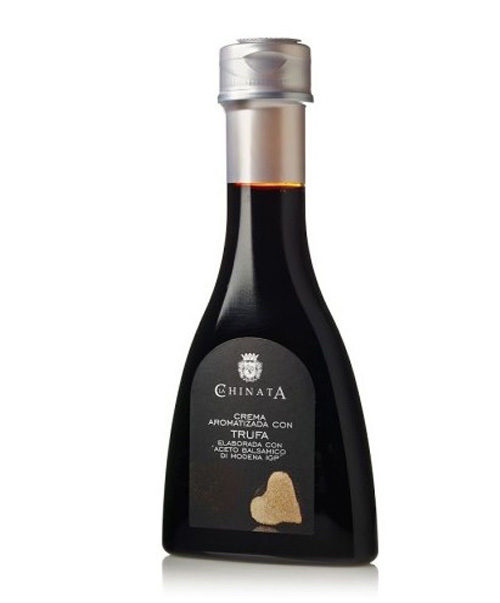 Flaske med cremet balsamico med trøffel klar til brug til kød, grøntsager og ost