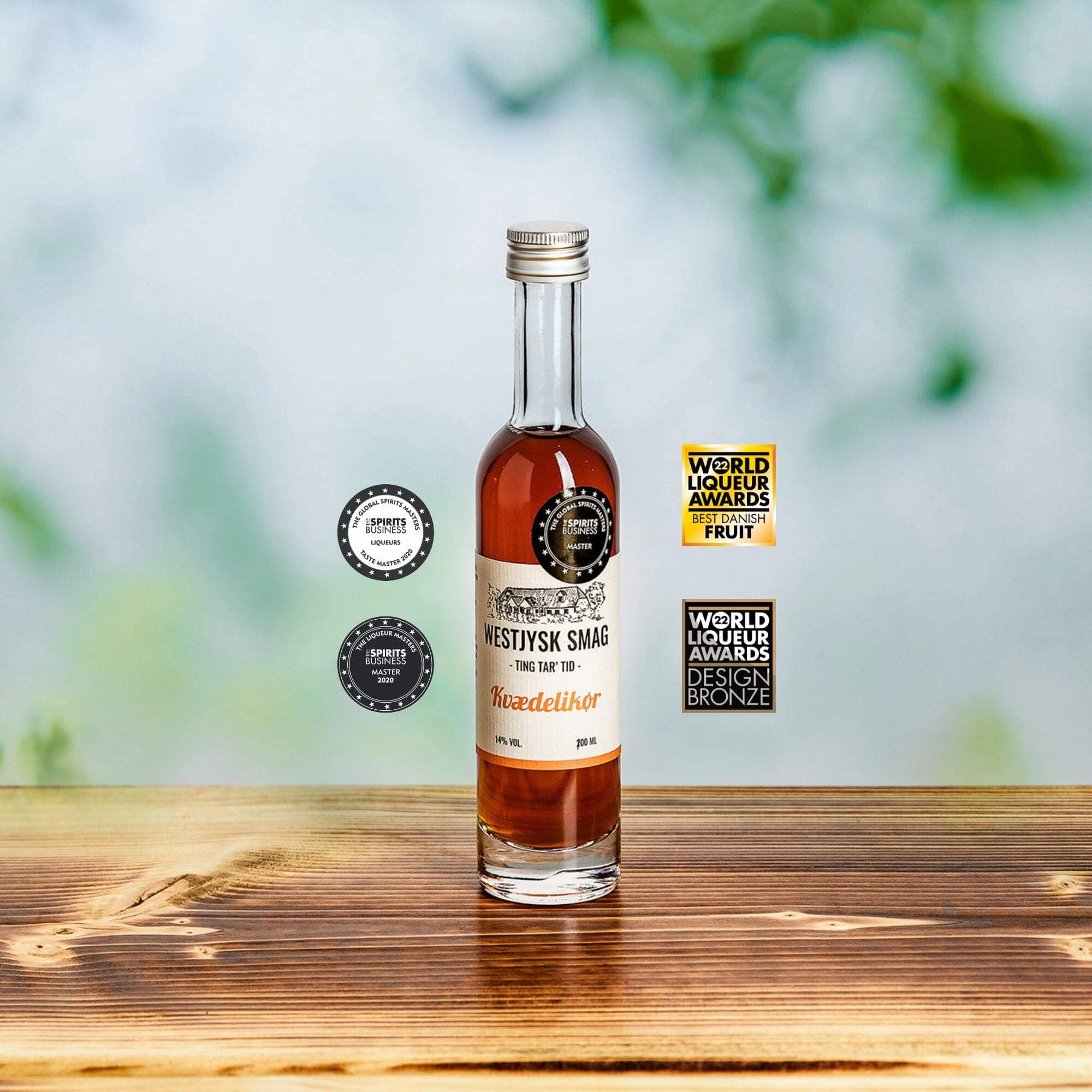 Flaske med kvæde likør 100 ml fra Westjysk Smag klar til servering til ostebord og desserter
