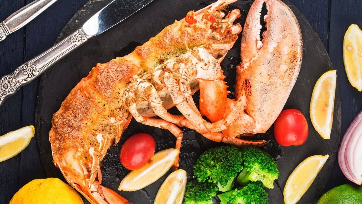 Lobster Thermidor with creamy lobster filling and crispy cheese top