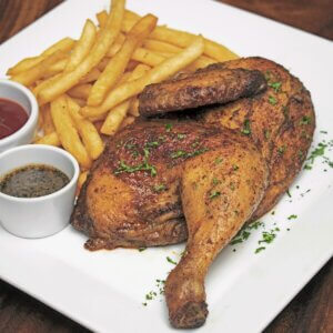Half grilled chicken with golden fries