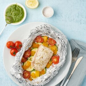 Cod parcel with green pesto and fresh tomatoes