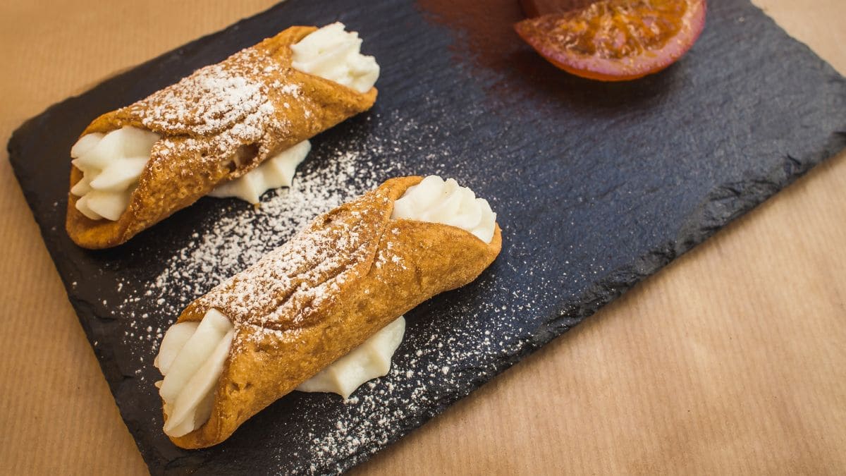 Cannoli – a traditional Sicilian dessert of crispy, tube-shaped fried pastry shells filled with sweet, creamy ricotta
